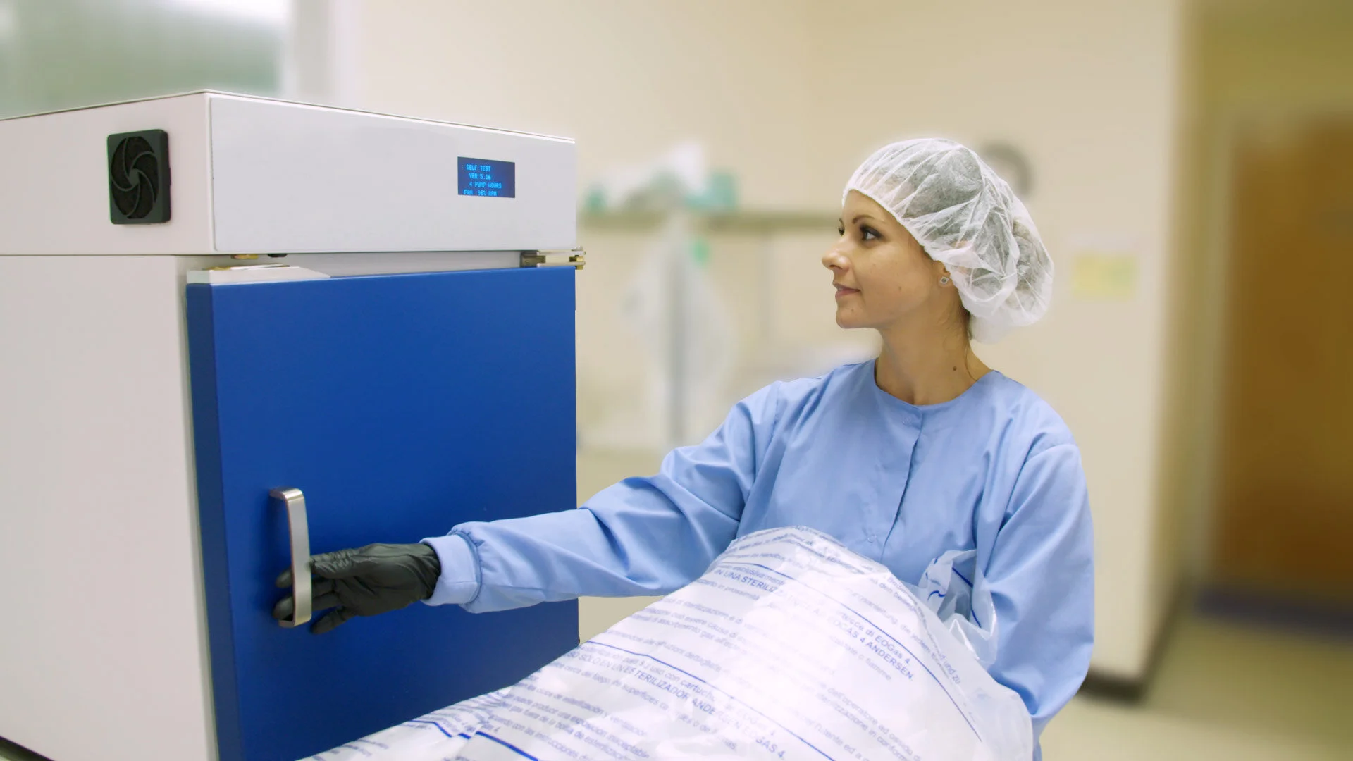 Parametrik technician loading the Andersen EOGas4 sterilizer